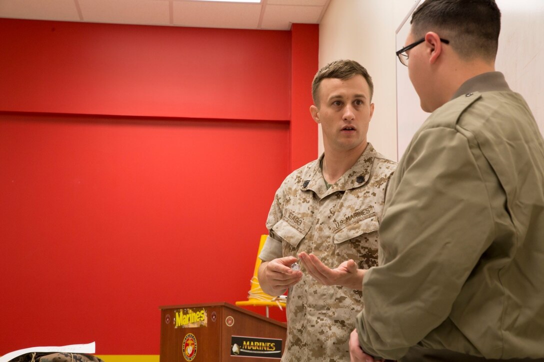 Staff Sgt. Christopher Stagg, G-4 operations chief, 4th Marine Division, Marine Forces Reserve, talks with a cadet about how to say “no” to drugs during Red Ribbon Week at New Orleans Military and Maritime Academy, Oct. 20, 2016. Red Ribbon Week is an annual event at NOMMA that allows Marines from Marine Corps Support Facility New Orleans to speak with cadets about the dangers of alcohol and drug addiction. (U.S. Marine Corps photo by Lance Cpl. Dallas Johnson/Released)