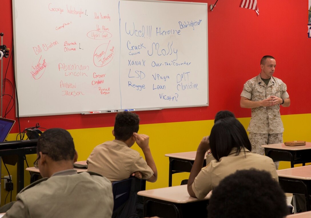 Master Sgt. James Grant, G-4, 4th Marine Division, Marine Forces Reserve, leads a guided discussion on drug and alcohol abuse during Red Ribbon Week at the New Orleans Military and Maritime Academy, Oct. 20, 2016. Grant had the students name as many past Presidents as they could, and then compared that to the number of different drugs and alcohols they could come up with. This was used to show the students that they are surrounded by drug paraphernalia and advertisements on a daily basis, and that the choices they make now can have a significant impact on their future. (U.S. Marine Corps photo by Lance Cpl. Dallas Johnson/Released)