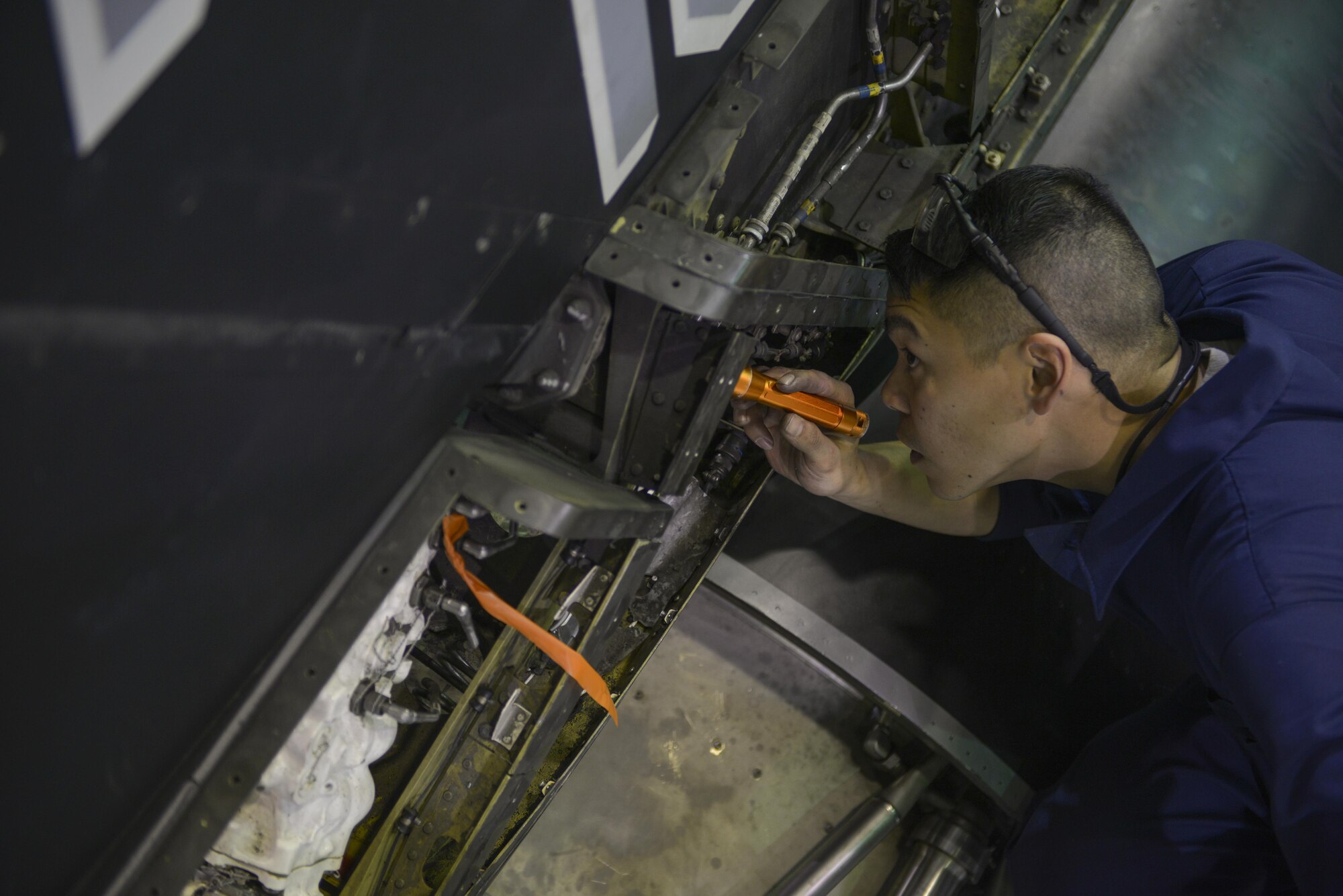 U.S. Air Force Senior Airman Danny Navo, a 354th Maintenance Squadron phase inspection section apprentice, works on the rudder of an F-16 Fighting Falcon aircraft Oct. 6, 2016, at Eielson Air Force Base, Alaska. Navo is preparing to take the rudder off. (U.S. Air Force photo by Airman Isaac Johnson)