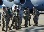U.S. Army Soldiers from Fort Eustis greet members of the 689th Rapid Port Opening Element after returning from Haiti at Joint Base Langley-Eustis, Va., Oct. 20, 2016. The 689th RPOE worked with members of the 621st Contingency Response Wing, Defense Logistics Agency and other Department of Defense assets as part of a joint task force in a massive effort to receive and sort supplies for those in need as a result of Hurricane Matthew. (U.S. Air Force photo by Airman 1st Class Tristan Biese)