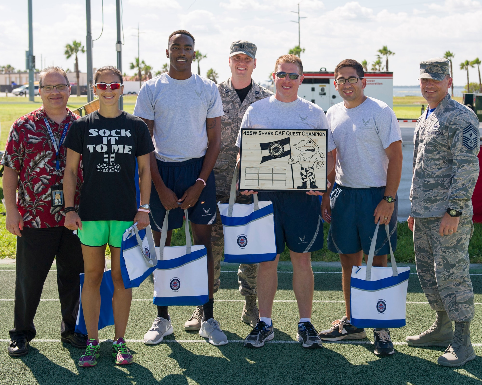 Members of the 45th Operations Group pose for a photo during the Wingman Multicultural Day, Oct. 21, 2016, at Patrick Air Force Base, Fla. The 45th Operations Group won the title of the 2016 Comprehensive Airman Fitness Challenge. The second place winner is the 45th Launch Group; third place winner is the 45th Medical Group; and the fourth places winner is the 45th Mission Support Group. (U.S. Air Force photo/Matthew Jurgens) 