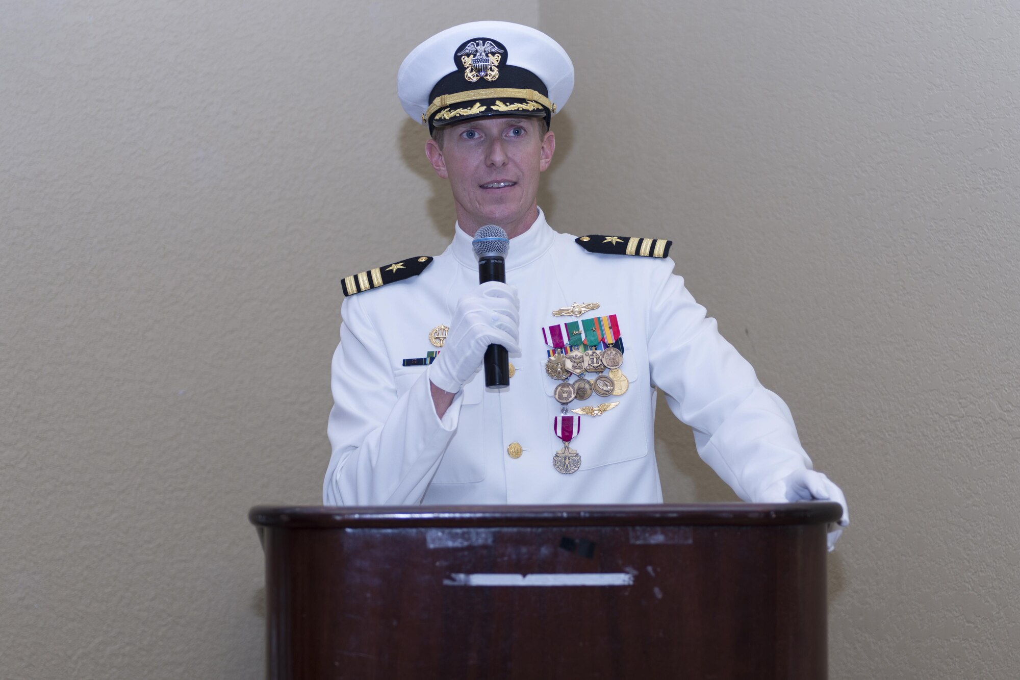 U.S. Navy Cmdr. Kenneth A. Wallace, outgoing Center for Naval Aviation Technical Training Unit Keesler commanding officer, delivers remarks during the CNATTU Keesler change of command ceremony at the Bay Breeze Event Center Oct. 20, 2016, on Keesler Air Force Base, Miss. Wallace will go on to serve at the Naval War College in Newport, R.I. (U.S. Air Force photo by Andre Askew/Released)