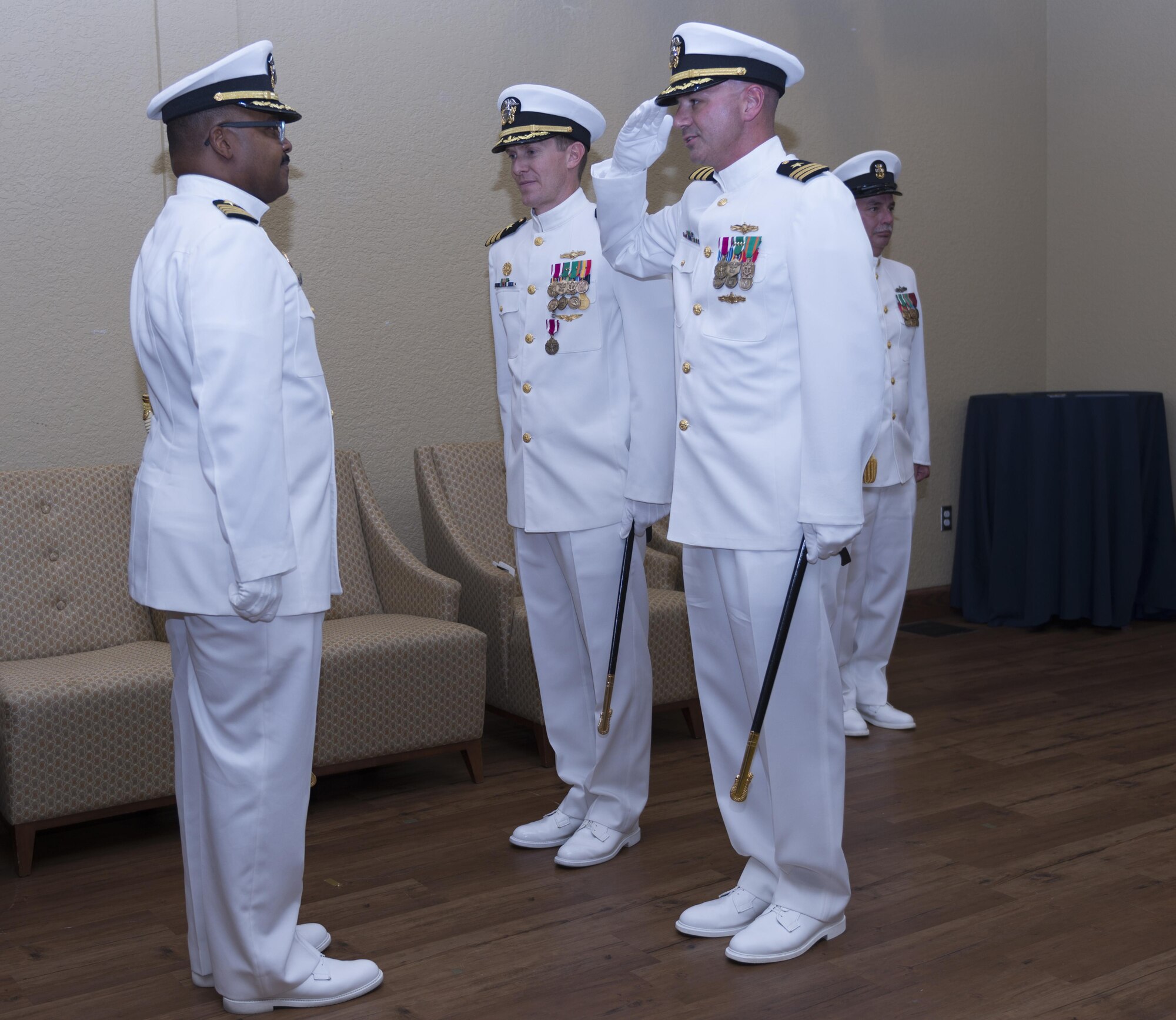 U.S. Navy Cmdr. Timothy Knapp, incoming Center for Naval Aviation Technical Training Unit Keesler commanding officer, salutes U.S. Navy Capt. Terry Hammond, Center for Naval Aviation Technical Training, commanding officer, Pensacola, Fla. at the CNATTU Keesler change of command ceremony at the Bay Breeze Event Center Oct. 20, 2016 on Keesler Air Force Base, Miss. Knapp was previously the executive officer at Fleet Weather Center, Norfolk, Va. Wallace is heading to Naval Warfare College, Newport, R.I. (U.S. Air Force photo by Andre’ Askew/Released)