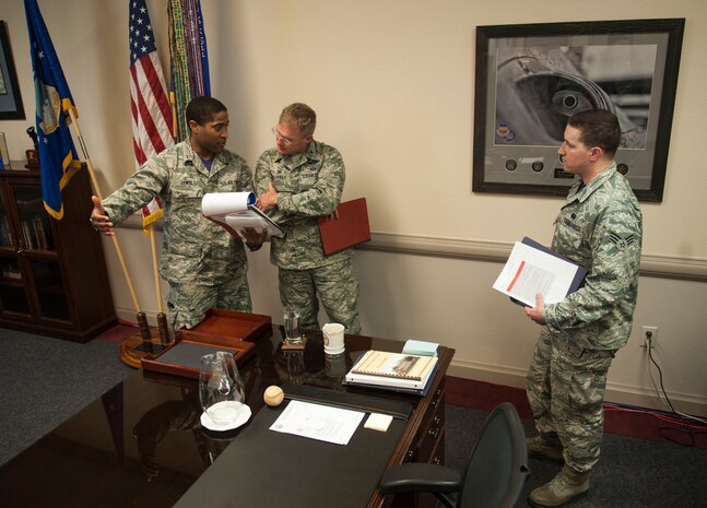 Members of the 99th Communication Squadron Cyber Readiness Inspection team speak with Col. Paul Murray, 99th Air Base Wing commander during the first readiness inspection on Nellis Air Force Base, Nev., Oct. 21.The CCRI is conducted by the Defense Information Systems Agency and it is designed to assess an installation’s overall cyber readiness and security of its Non-secure Internet Protocol Router Network and Secure Internet Protocol Router Network systems. While the 99th Communication Squadron has the lead during this inspection and will do most of the preparation for the inspection itself, it is every team Nellis/Creech/NTTR members’ duty to remain cognizant of basic cyber security pitfalls.(U.S. Air Force photo by Senior Airman Rachel Loftis)
