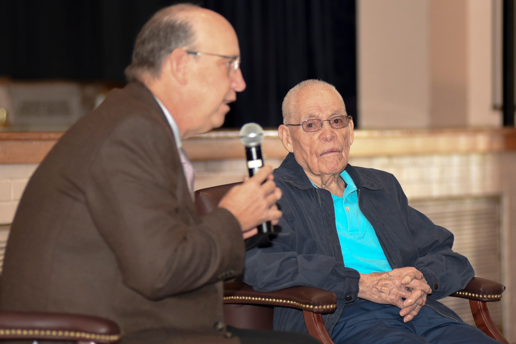 Jeff Longwell, left, Wichita, Kansas mayor, speaks to Airmen at McConnell Air Force Base, Kan., Oct. 20, 2016. Longwell joined Eddie Graham, retired Army sergeant, during a speech about how Grahams experiences during World War II and surviving the Bataan Death March. (U.S. Air Force photo/Senior Airman Christopher Thornbury) 