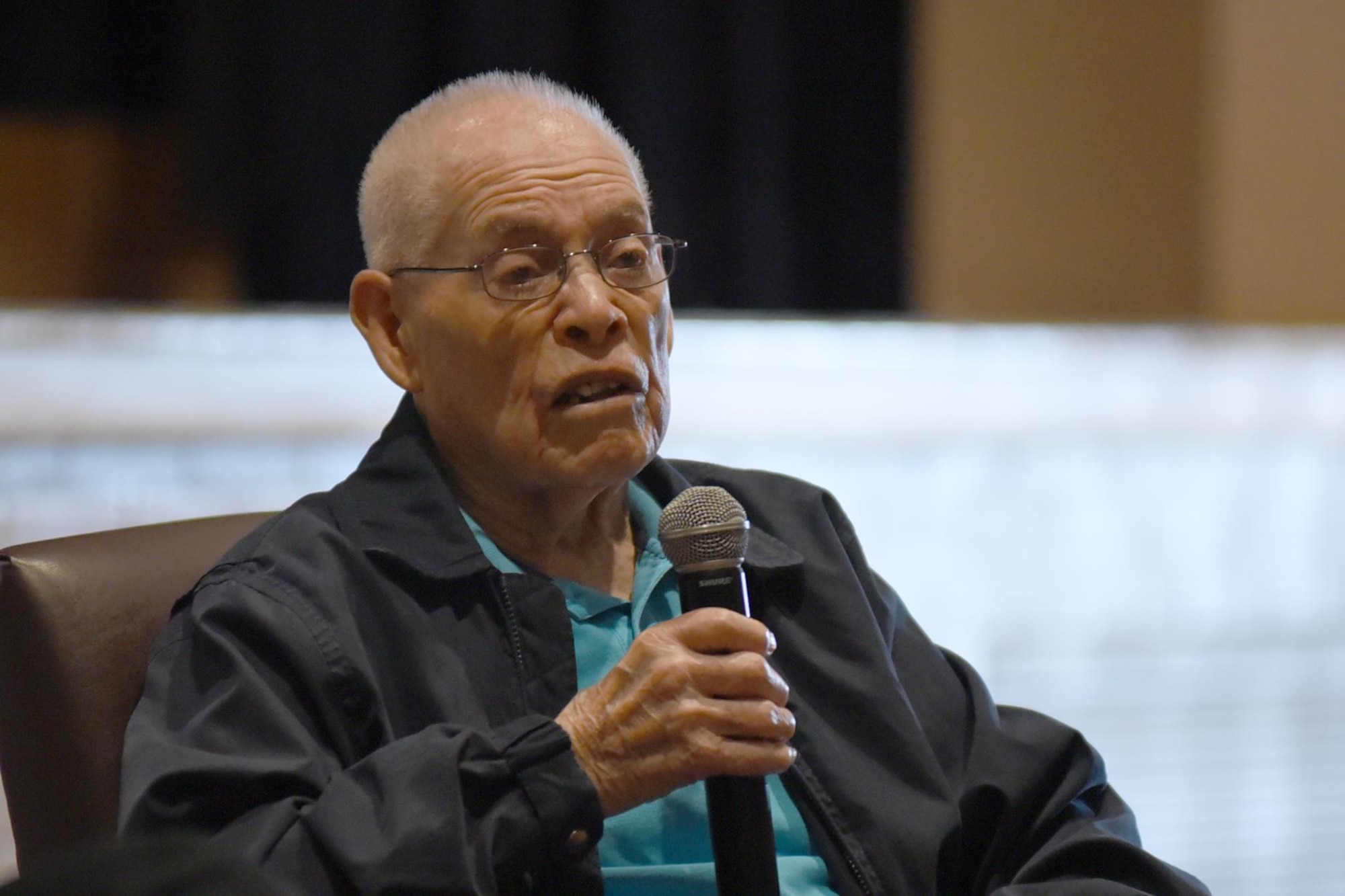 Eddie Graham, retired Army sergeant, speaks to Airmen at McConnell Air Force Base, Kan., Oct. 20, 2016. Graham gave a speech about how his experiences during World War II and surviving the Bataan Death March. (U.S. Air Force photo/Senior Airman Christopher Thornbury)