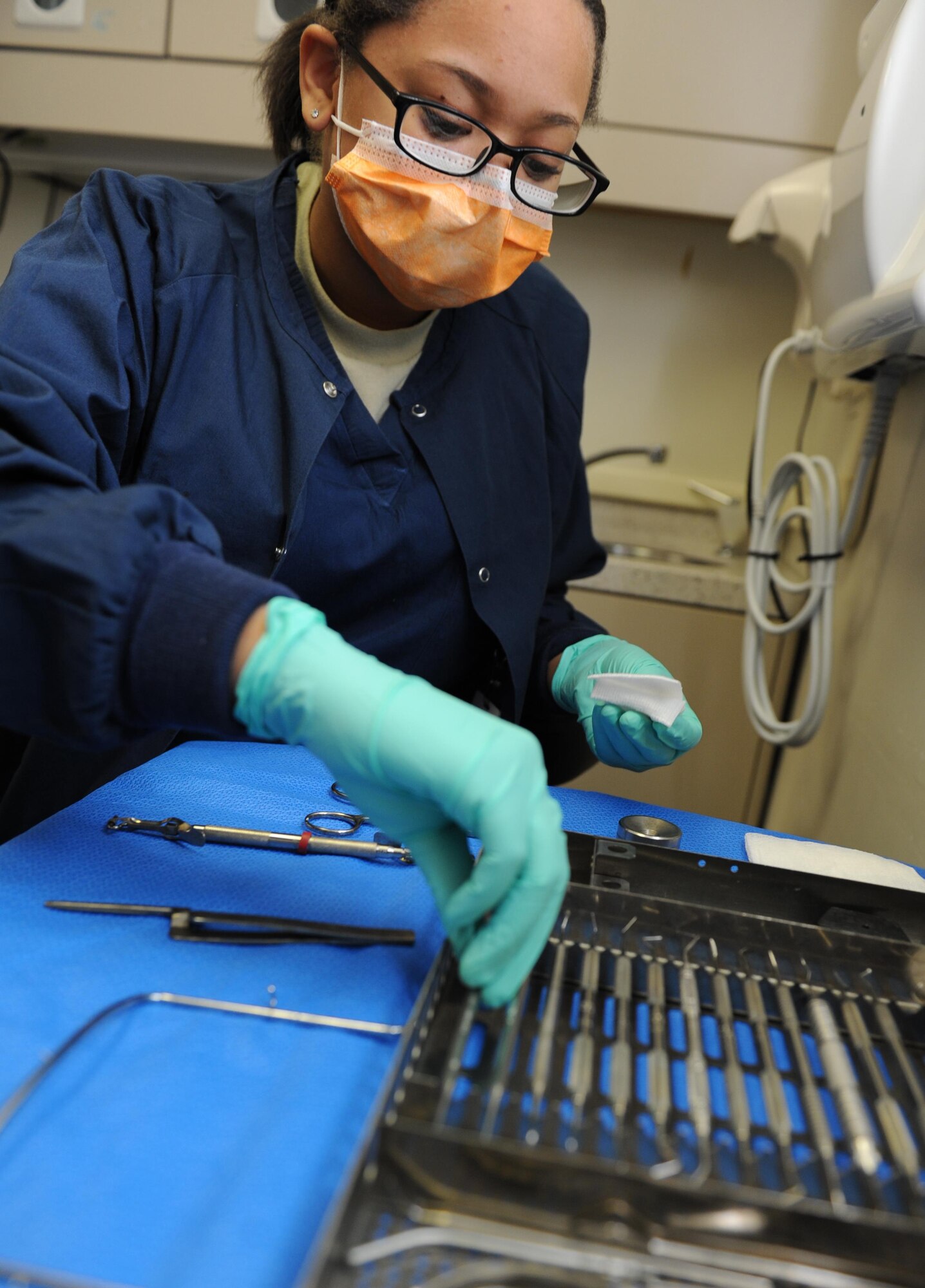 Airman 1st Class Ashli Pointer, 81st Dental Squadron dental technician, prepares dental tools for a patient at the dental clinic Feb. 10, 2016, on Keesler Air Force Base, Miss. October is National Dental Hygiene Month. The goal of NDHM is to increase public awareness about the importance of maintaining good oral health. (U.S. Air Force photo by Kemberly Groue)