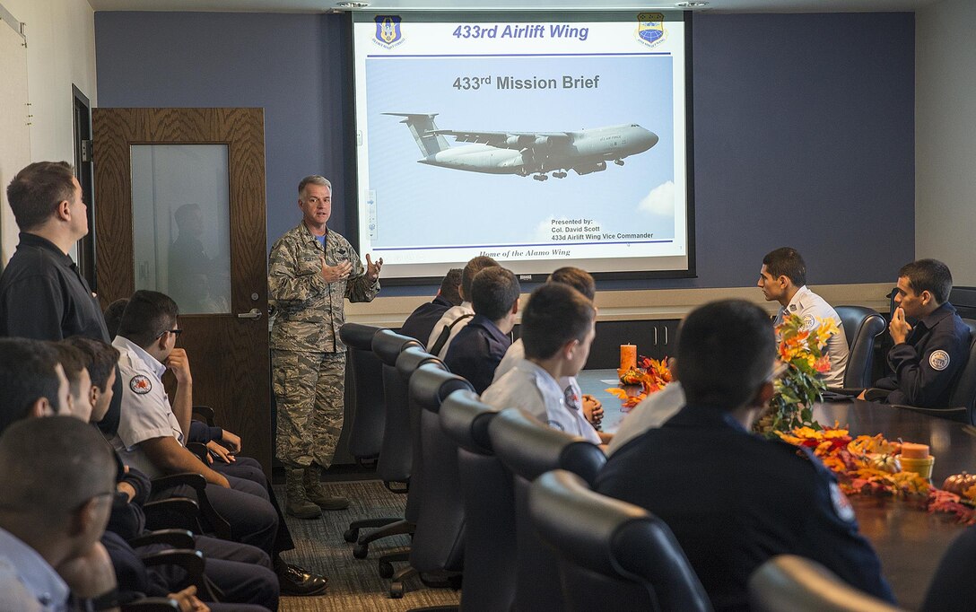 Col. David A. Scott, 433rd Airlift Wing vice commander, gives a mission briefing to Air Force Junior ROTC students from United High School Oct. 21, 2016 at Joint Base San Antonio-Lackland, Texas. Also while visiting Lackland, students attended an Air Force basic training graduation, toured a C-5M Super Galaxy aircraft, and had lunch at the Live Oak Inn dining facility. (U.S. Air Force photo by Benjamin Faske)