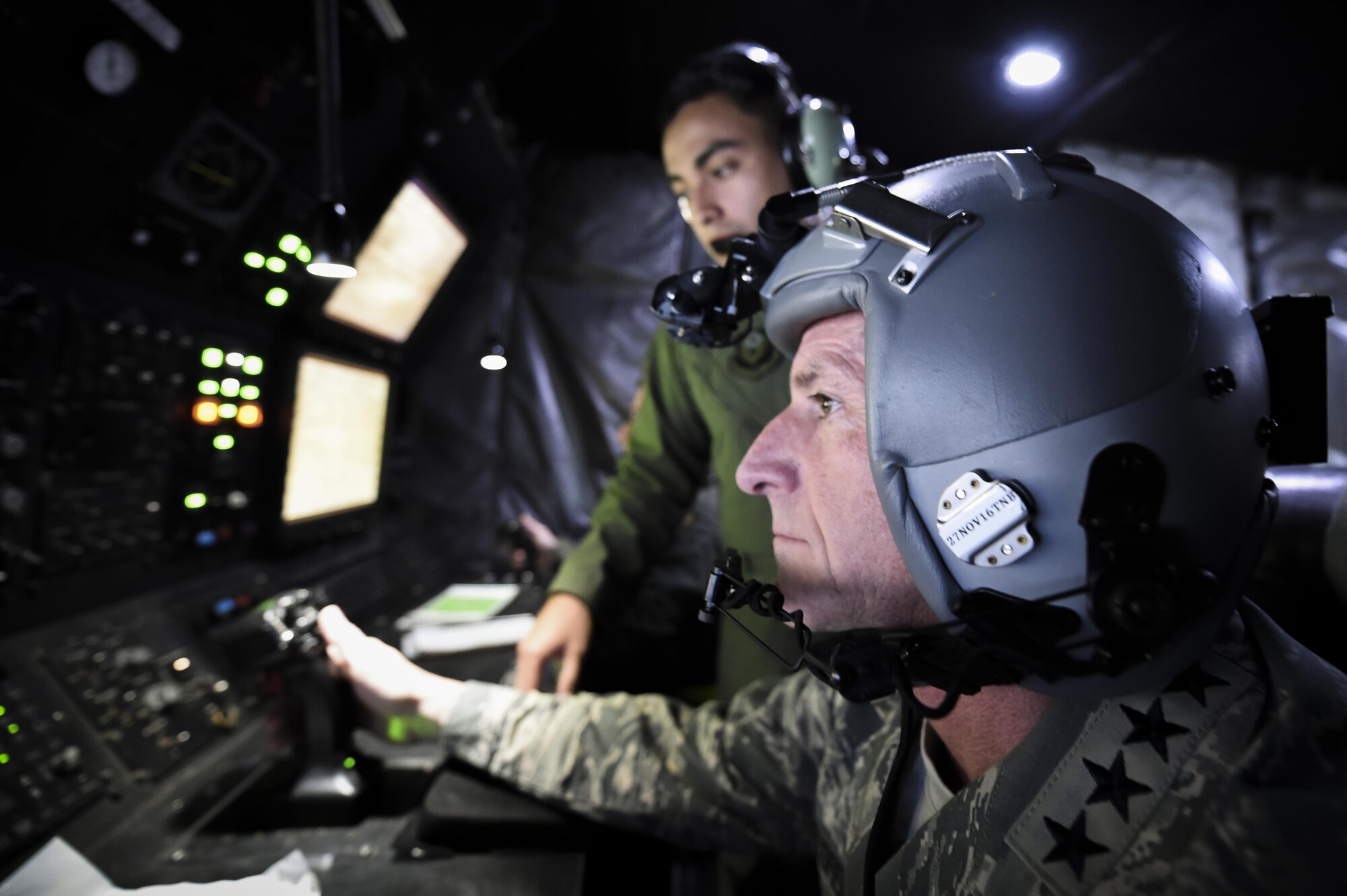 Air Force Chief of Staff Gen. David L. Goldfein operates AC-130U Spooky gunship equipment during a Spooky mission orientation flight at Hurlburt Field, Fla., Oct. 19, 2016. Goldfein was the keynote speaker at the Special Tactics Memorial dedication ceremony at the Hurlburt Field Air Park. During their visit, Goldfein and his wife, Dawn, met with AFSOC, 505th Command and Control Wing, and base leadership and personnel.  (U.S. Air Force photo by Senior Airman Jeff Parkinson)