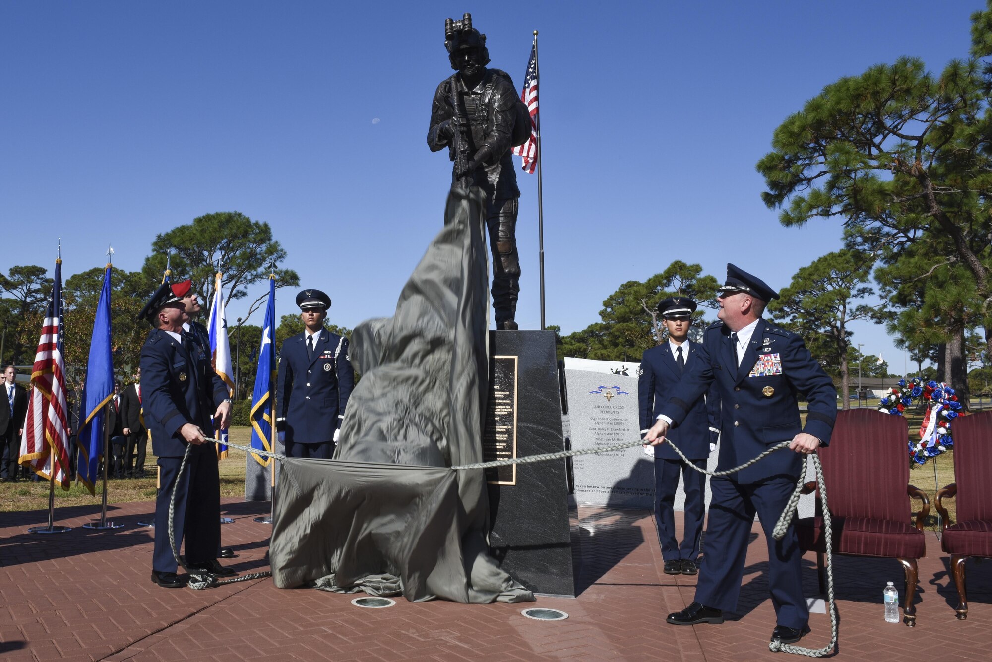 Air Force Chief of Staff David L. Goldfein and Lt. Gen. Brad Webb, the commander of Air Force Special Operations Command, unveil the Special Tactics Memorial during a dedication ceremony at Hurlburt Field, Fla., Oct. 20, 2016. Goldfein was the keynote speaker for the ceremony. In addition to the ceremony, he met with Air Force Special Operations Command leadership, 505th Command and Control Wing personnel and Air Commandos around base. (U.S. Air Force photo by Senior Airman Jeffrey Parkinson)