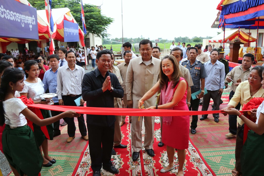 Julie Chung (right), Deputy Chief of Mission for the U.S. Embassy, participates in a ribbon-cutting ceremony for the newly-constructed primary school in Kampong Speu Province, Cambodia. Other dignitaries in attendance include Vy Samnang (left), Governor of Kampong Speu Province, and Heang Sine (center), Undersecretary of State for the Cambodian Ministry of Education. The Alaska District completed this project in support of U.S. Pacific Command’s Humanitarian Assistance Program.