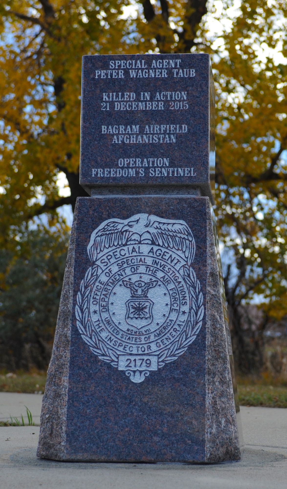 A monument dedicated to Special Agent Peter Taub, a member of the Air Force Office of Special Investigations Detachment 816, stands in Memorial Park at Ellsworth Air Force Base, S.D., Oct. 18, 2016. A building dedication ceremony was also held Oct. 21 to honor Taub, who was killed during an attack by a suicide bomber on a motorcycle near Bagram Airfield, Afghanistan, Dec. 21, 2015. (U.S. Air Force photo by Airman 1st Class Denise M. Jenson)