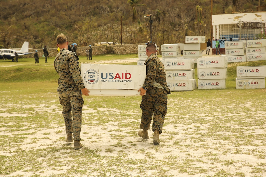 U.S. service members with Joint Task Force Matthew unload supplies from a CH-47 Chinook helicopter at a landing zone at Jeremie, Haiti, Oct. 9, 2016. JTF Matthew, a U.S. Southern Command-directed team deployed to Port-au-Prince at the request of the Government of Haiti, on a mission to provide humanitarian and disaster relief assistance in the aftermath of Hurricane Matthew. (U.S. Marine Corps photo by Cpl. Samuel Guerra)