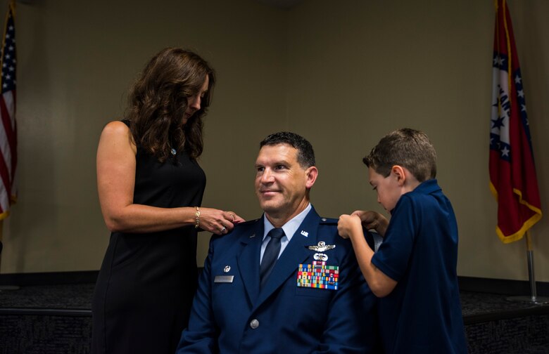 Col. Leon Dodroe, 188th Operations Group commander, has his wife and son pin his new rank Oct. 16, 2016, during his promotion ceremony at Ebbing Air National Guard Base, Fort Smith, Ark. Dodroe joined the Air National Guard in 2010 after serving in the Army, Army National Guard and Army Reserves for 17 years. (U.S. Air National Guard photo by Senior Airman Cody Martin)