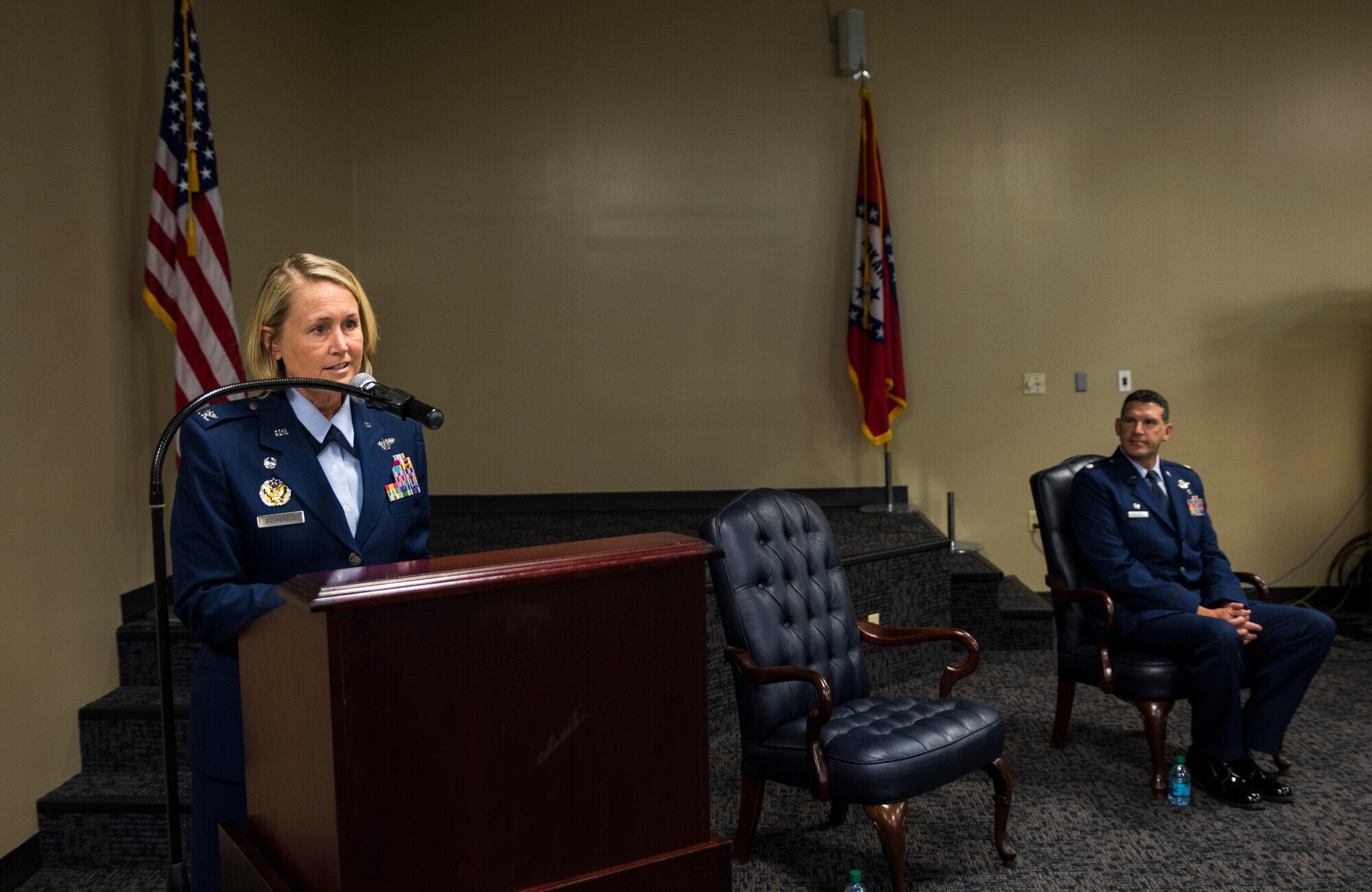 Col. Bobbi Doorenbos, 188th Wing commander, describes the poise and demeanor of Col. Leon Dodroe, 188th Operations Group commander, Oct. 16, 2016, during Dodroe’s promotion ceremony at Ebbing Air National Guard Base, Fort Smith, Ark. Dodroe later spoke highly of Doorenbos and how he felt he blossomed under her leadership when they both served in the Arizona Air National Guard. (U.S. Air National Guard photo by Senior Airman Cody Martin)