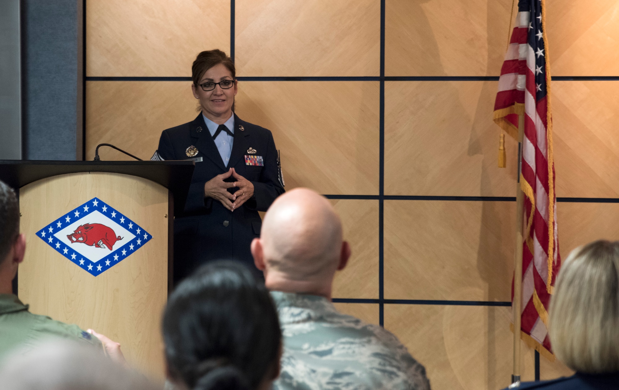 Chief Master Sgt. Magda Hamblin, 188th Force Support Squadron superintendent, speaks to her friends and family in attendance Oct. 15, 2016, during her promotion ceremony at Ebbing Air National Guard Base, Fort Smith, Ark. During the ceremony, Hamblin explained that in order to make chief, it took hard work and the support of her three families: the ANG, the 188th and her family and friends. (U.S. Air National Guard photo by Tech. Sgt. Daniel Condit)