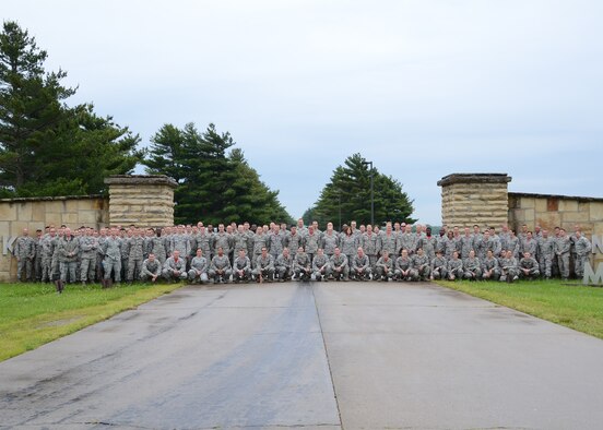 Maj. Jeffrey M. Bishop, chief, 131st Bomb Wing Public Affairs, poses for a “family portrait” along with more than 100 other Citizen-Airmen in his Guard Family, all members of the 131st Bomb Wing, during AT Week field training at Camp Clark near Nevada, Missouri, May 2016. (U.S. Air National Guard photo by Airman 1st Class Halley Burgess)