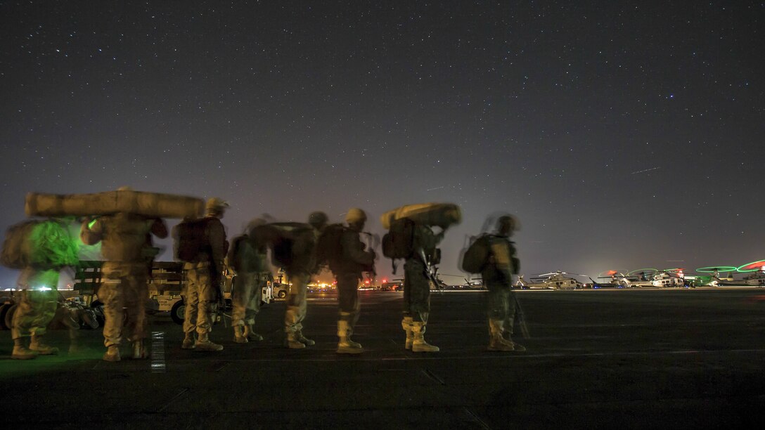 <strong>Photo of the Day: Oct. 24, 2016</strong><br/><br />Marines wait to board a plane during Weapons and Tactics Instructor Course 1-17 at Marine Corps Air Ground Combat Center Twentynine Palms, Calif., Oct. 18, 2016. The seven-week event emphasizes operational integration of the six functions of Marine Corps aviation. Marine Corps photo by Lance Cpl. Danny Gonzalez<br/><br /><a href="http://www.defense.gov/Media/Photo-Gallery?igcategory=Photo%20of%20the%20Day"> Click here to see more Photos of the Day. </a>


