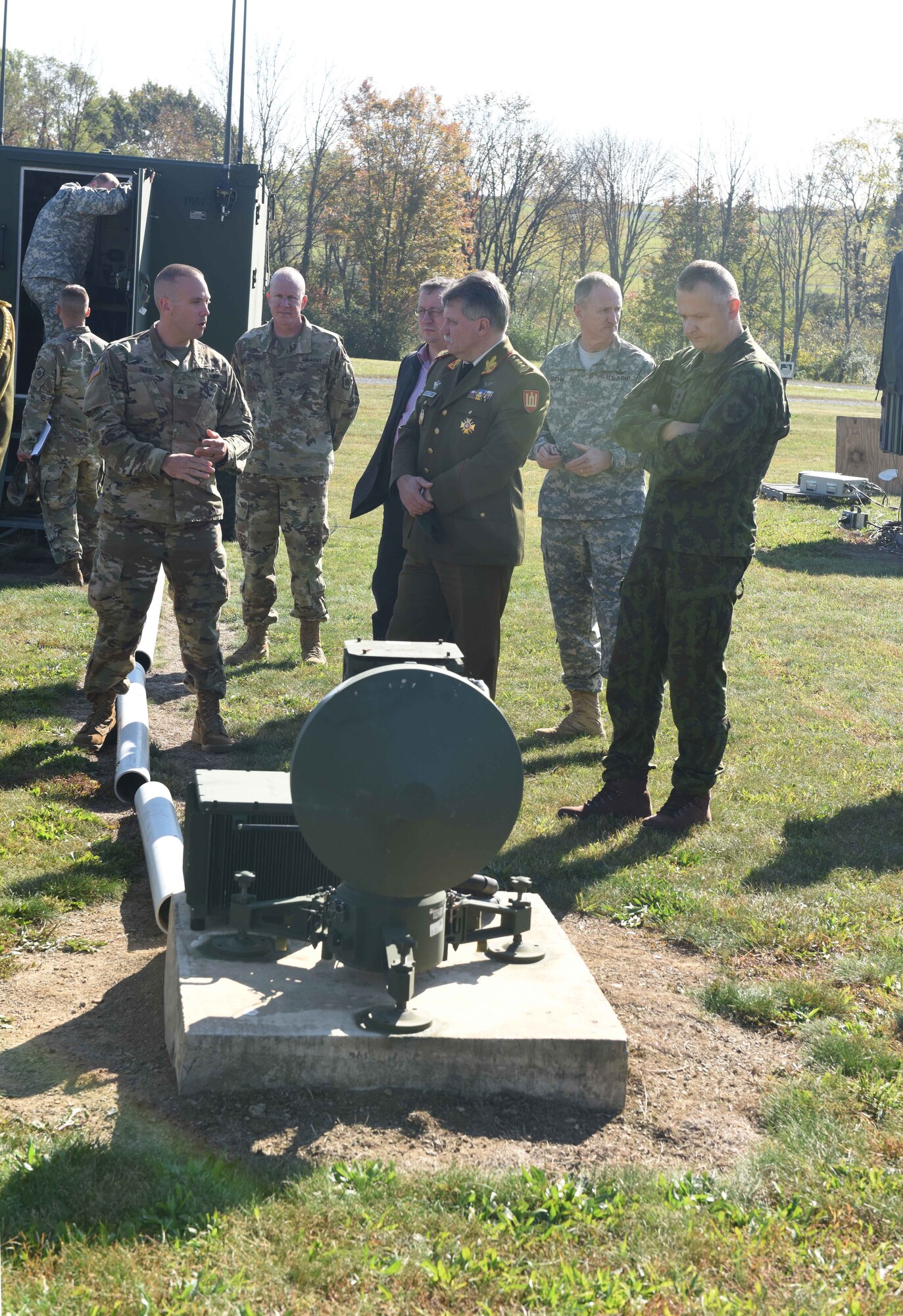 Soldiers of the Pennsylvania Army National Guard’s unmanned aerial vehicle fleet explain its processes and functions to Lt. Gen. Jonas Vytautas Zukas (center), chief of defense of Lithuania, during a tour of the facilities Oct. 15 at Fort Indiantown Gap, Annville, Pa. Airmen and soldiers with the Pennsylvania National Guard spent the day with Lithuanian officials, fostering a state-country partnership that began in 1993. (U.S. Air National Guard photo by Tech. Sgt. Claire Behney/Released)