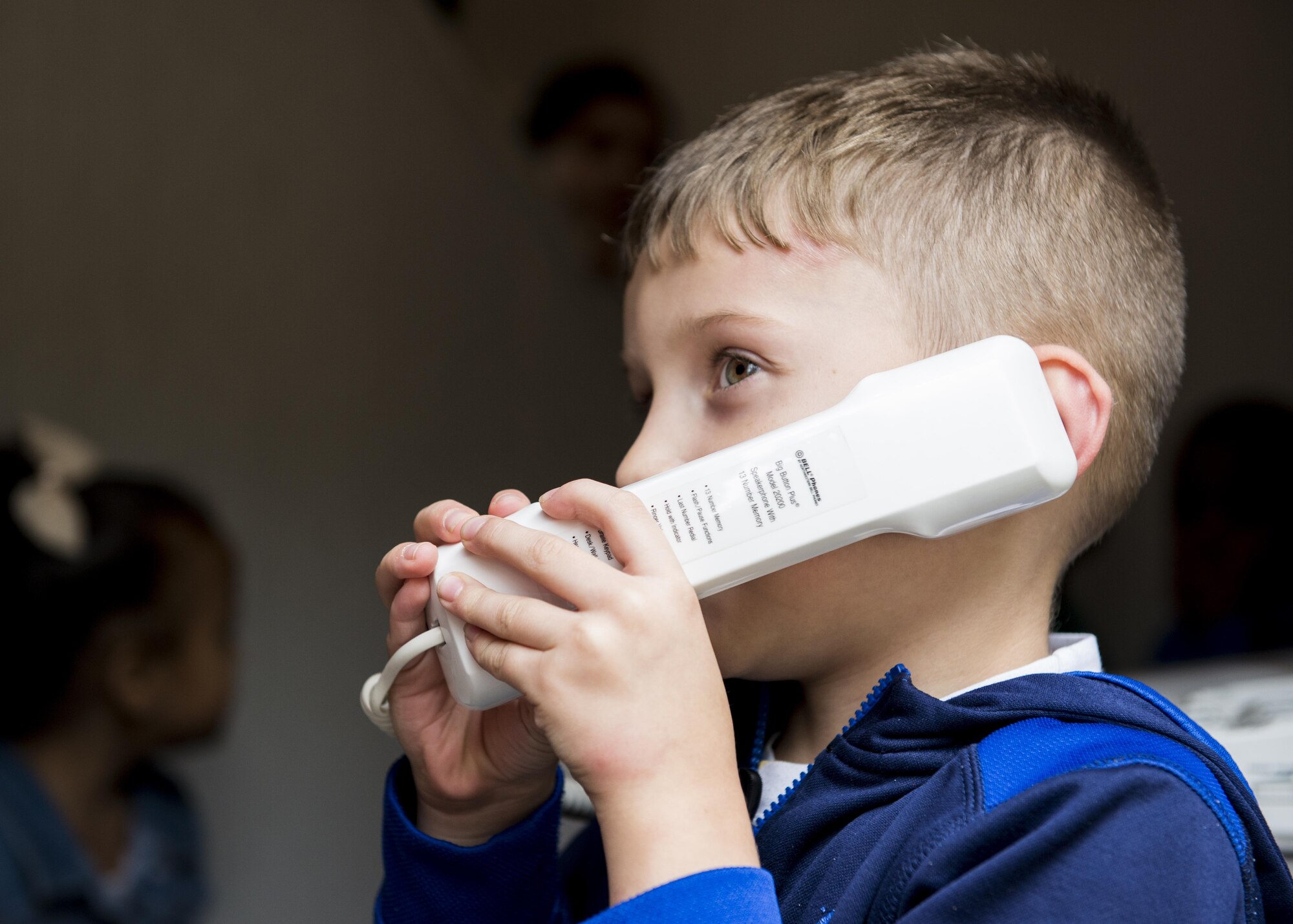 A student from Joan K. Mendel elementary school practices reporting a fire to emergency services during Fire Prevention Week on 13 Oct. 2016 at Yokota Air Base, Japan. This year’s Fire Prevention Week theme is “Don’t Wait, Check the Date!” encouraging families to check their smoke alarms expiration date and batteries. (U.S. Air Force Photo by Airman 1st Class Donald Hudson/Released)