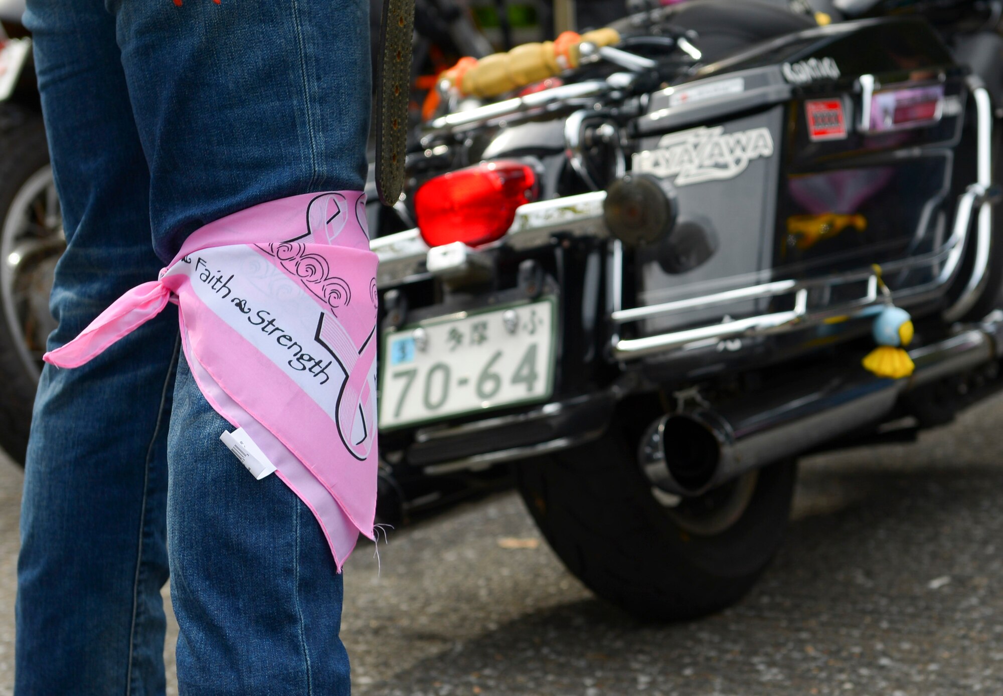 A participant in the Green Knights Military Motorcycle Club Chapter 136 inaugural breast cancer awareness ride, “Bikers for Boobies,” relaxes after the ride at Okutama prefecture, Japan, Oct. 16, 2016. The Green Knights Military Motorcycle Club invited community members on and off base to participate in the ride and donate to breast cancer research, raising almost $1000. (U.S. Air Force photo by Airman 1st Class Elizabeth Baker/Released)