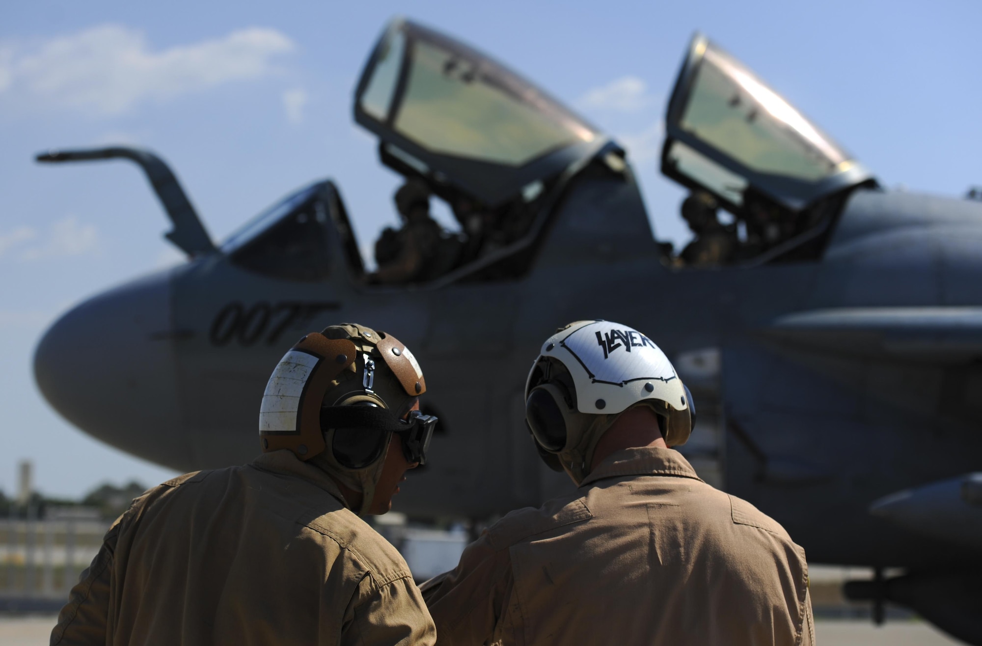 U.S. Marine Corps Sgt. Eduardo Mendez, Tactical Electronic Warfare Squadron 4 (VMAQ-4) powerline collateral duty quality assurance representative, and Staff Sgt. Brian Franzi, VMAQ-4 quality assurance representative, standby during a preflight check on an EA-6B Prowler Sept. 16, 2016, at Incirlik Air Base, Turkey. The Prowler is used as an electronic warfare platform to disable enemy communication capabilities. (U.S. Air Force photo by Airman 1st Class Devin M. Rumbaugh)