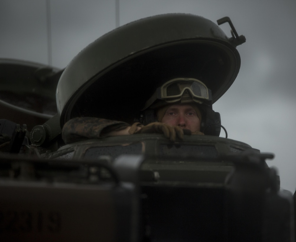 U.S. Marine Sgt. Shawn Dickens, from St. Augustine, Fla., looks out from an assault amphibious vehicle on Subic Bay, Philippines, during Philippine Amphibious Landing Exercise 33 (PHIBLEX), Oct. 7, 2016.  PHIBLEX is an annual U.S-Philippine military bilateral exercise that combines amphibious capabilities and live-fire training with humanitarian civic assistance efforts to strengthen interoperability and working relationships. Dickens is a section leader with 3rd Assault Amphibian Battalion, 1st Marine Division, I Marine Expeditionary Force. (U.S. Marine Corps photo by Lance Cpl. Nelson Duenas/Released)
