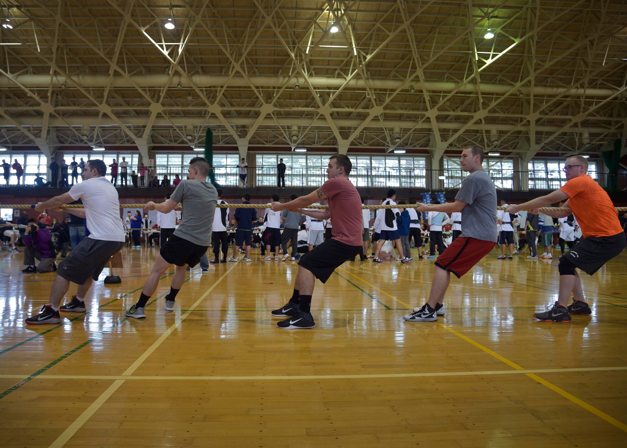 The U.S. Air Force team, comprised of Airmen with the 35th Maintenance Squadron aerospace propulsions shop, competes during the 15th Annual Northern Air Defense Force Commander’s Cup tug of war event, at Misawa Air Base, Japan, Oct. 22, 2016. Each team consisted of 15 military members and awards were given out for the top three teams and winner in an exhibition match. In addition to this event, Japan Air Self-Defense Force held a friendship party to help participants bond in a non-work environment. (U.S. Air Force photo by Senior Airman Deana Heitzman)