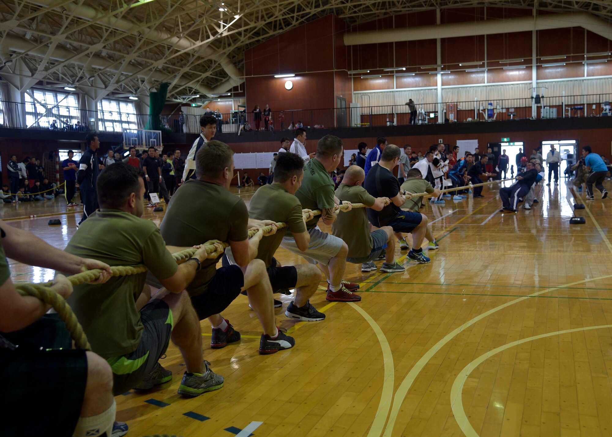 Military members from the Royal Air Force and Japan Air Self-Defense Force compete in the 15th Annual Northern Air Defense Force tug of war event, at Misawa Air Base, Japan, Oct. 22, 2016. The Royal Air Force had an opportunity to join this annual event due to their presence here for Guardian North 16, the first-ever bilateral exercise, with JASDF members. In addition to this event, JASDF also held a friendship party to help participants bond in a non-work environment. (U.S. Air Force photo by Senior Airman Deana Heitzman)