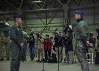 Japan Air Self-Defense Force Maj. Gen. Koji Imaki, left, 3rd Air Wing commander, welcomes Royal Air Force Wing Commander Roger Elliot, right, II Army Co-operation Squadron commanding officer RAF Lossiemouth, during the opening ceremony of exercise Guardian North 16, at Misawa Air Base, Japan, Oct. 22, 2016.  More than 200 British personnel, accompanied by four Eurofighter Typhoons, a Voyager British tanker and a RAF C-17 Globemaster III, will exchange knowledge and interoperability techniques in the first-ever bilateral exercise with Japan. RAF Lossiemouth is located in Moray, Scotland. (U.S. Air Force photo by Senior Airman Deana Heitzman)