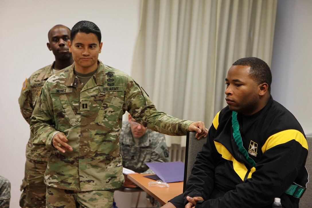 Army Capt. Sway Nunez, of the 254th Medical Detachment, left, speaks during a “train the trainer” lesson in the science of sleep to Army Reserve medical professionals of the Medical Support Unit of the 7th Mission Support Command in a briefing conducted at Daenner Kaserne on Oct. 22, 2016.