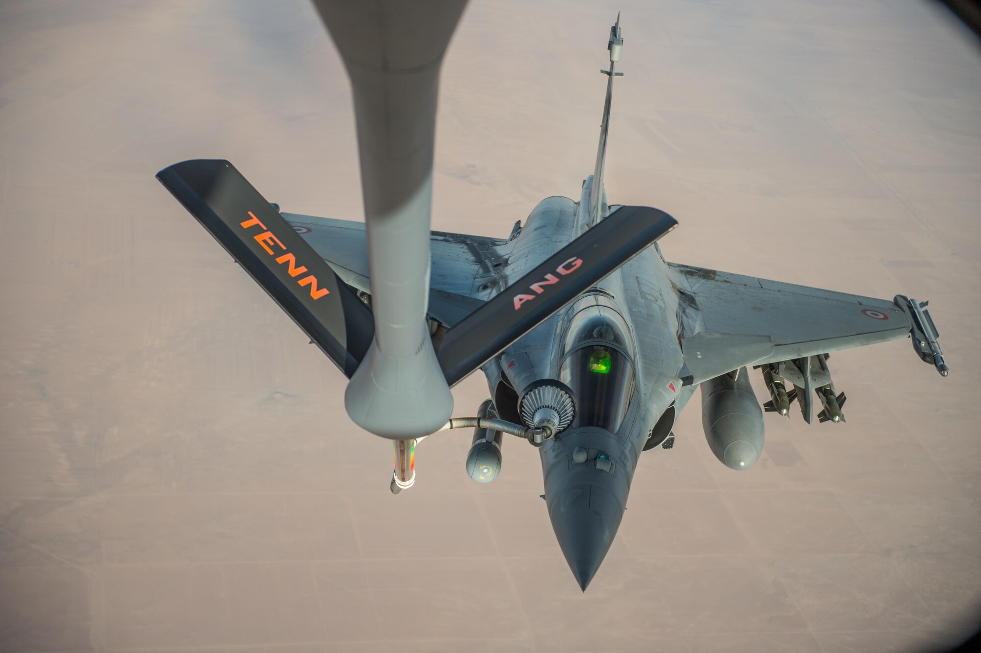 A French air force Rafale receives fuel from a KC-135 Stratotanker over Iraq in support of Operation Inherent Resolve Oct 17, 2016. The operational mission of Operation Inherent Resolve is to militarily defeat Da'esh in the Combined Joint Operation Area in order to enable whole-of-coalition governmental actions to increase regional stability. (U.S. Air Force photo by Staff Sgt. Douglas Ellis/Released)
