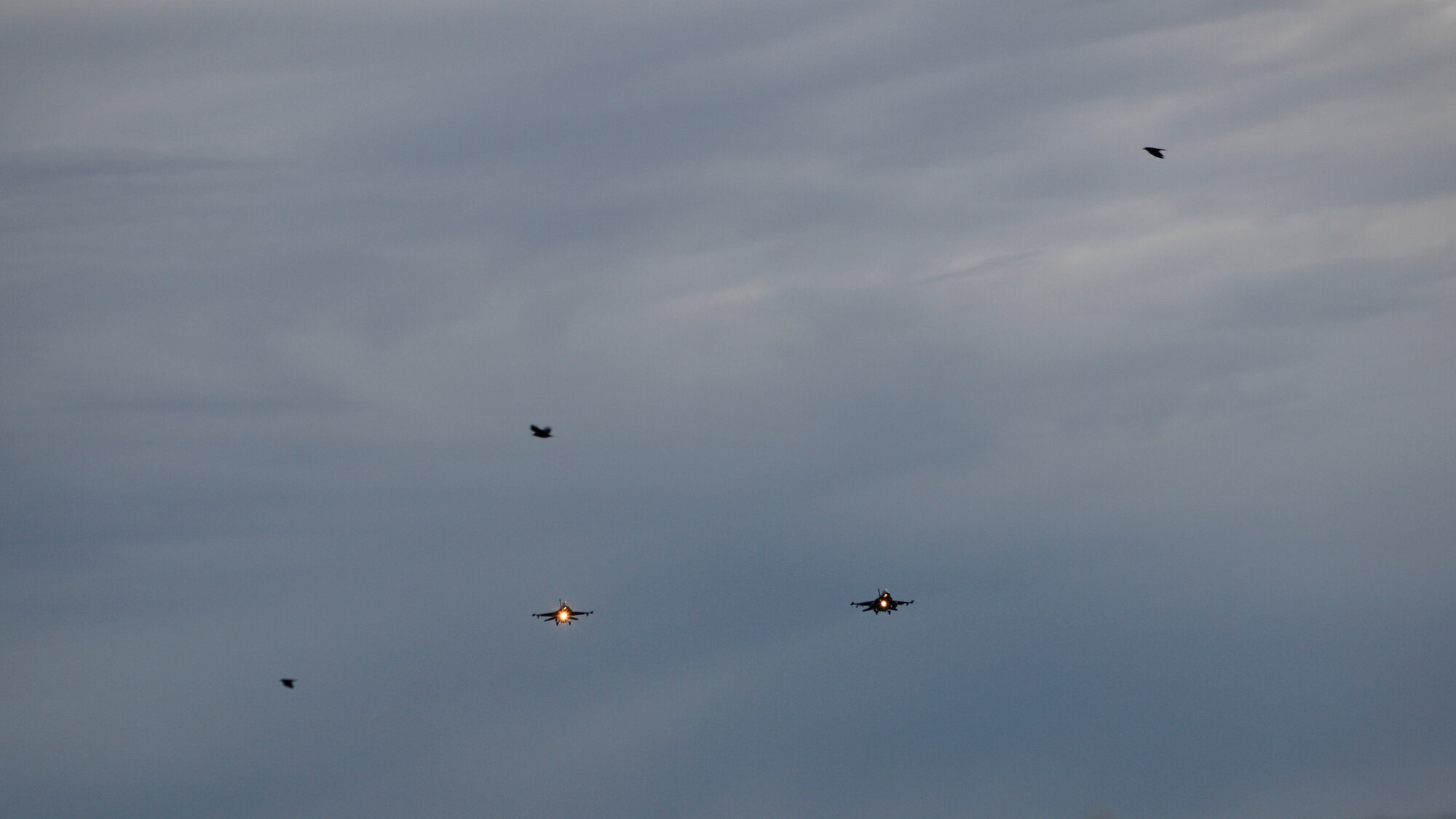Two F-16 Fighting Falcons fly over Aviano Air Base, Italy on Oct. 20, 2016. The 555th and 510th Fighter Squadrons ensure the 31st Fighter Wing is ready to deliver combat air power and support across the globe. (U.S. Air Force photo by Staff Sgt. Krystal Ardrey/Released)