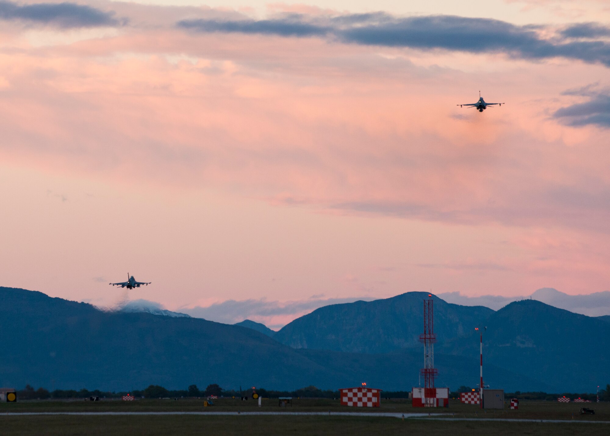 Two F-16 Fighting Falcons fly over Aviano Air Base, Italy on Oct. 20, 2016. The 555th and 510th Fighter Squadrons ensure the 31st Fighter Wing is ready to deliver combat air power and support across the globe. (U.S. Air Force photo by Staff Sgt. Krystal Ardrey/Released)