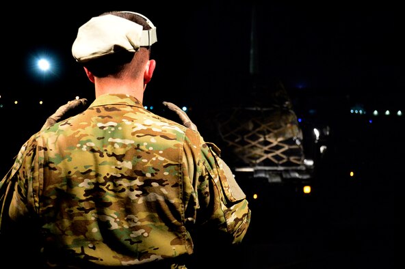 Senior Master Sgt. Kyle Gurnon, 737th Expeditionary Airlift Squadron loadmaster, directs cargo onto a C-130J Super Hercules at an undisclosed location in Southwest Asia before a mission to Qayyarah West Airfield, Iraq, Oct. 21, 2016. The 737th EAS flew the first coalition mission into the airfield since the start of Operation Inherent Resolve. (U.S. Air Force photo by Staff Sgt. Aaron Richardson/Released)