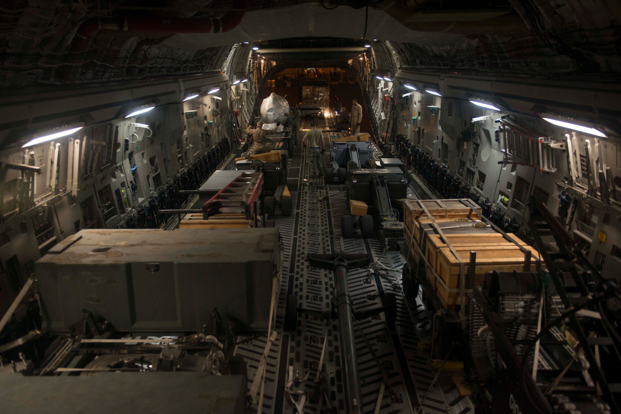 U.S. Airmen assigned to the 7th and 8th Airlift Squadrons load and secure cargo on a C-17 Globemaster III Oct. 21, 2016, at Incirlik Air Base, Turkey. Loadmasters use proper weight distribution when securing cargo to ensure the aircraft remains properly leveled during flight. (U.S. Air Force photo by Senior Airman John Nieves Camacho)