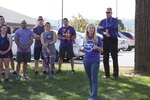 A.J. Brandt, DLA Distribution’s sexual assault response coordinator gives opening remarks before the Domestic Violence Awareness 5K Fun Run and two-mile walk kicks off.
