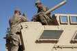 Army Reserve Sgt. Charles Smalley and Sgt. Alex Katz, both signal support systems noncommissioned officers with the 451st Expeditionary Sustainment Command, install a Blue Force Tracker system on a tactical vehicle for the 300th Sustainment Brigade Det. 2, Sept. 20, 2016 at an undisclosed location in Iraq. (Army Photo by Spc. Milagro Perez, Unit Public Affairs Representative)