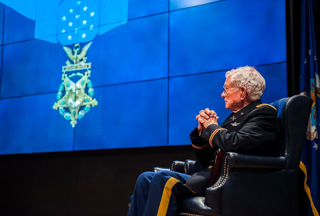 Army Lt. Col. Charles Kettles (Ret.) on stage during a visit to DLA Land and Maritime Oct. 19. Kettles was awarded the Medal of Honor July 18 for actions he performed as a helicopter pilot in Vietnam, during which he saved the lives of 44 men. 