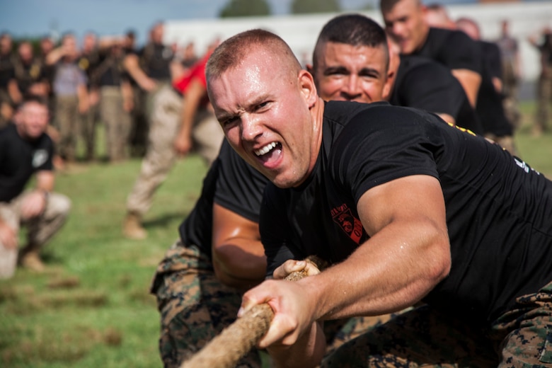 Second Lieutenant Tyler R. Watkins leads Delta Company during a field meet at Officer Candidates School, aboard Marine Corps Base Quantico, Va., Aug. 4, 2016. Once an NCAA Division I athlete, Watkins transitioned from trying to play football professionally to his dreams of becoming a Marine officer. He graduated OCS with Officer Candidate Class 222, which had the most OCS graduates since 2009, on Aug. 6, 2016. Due to injuries sustained during OCS, he is temporarily assigned to the Plans and Research section at Marine Corps Recruiting Command aboard MCB Quantico. Watkins hopes to return to training in March 2017.