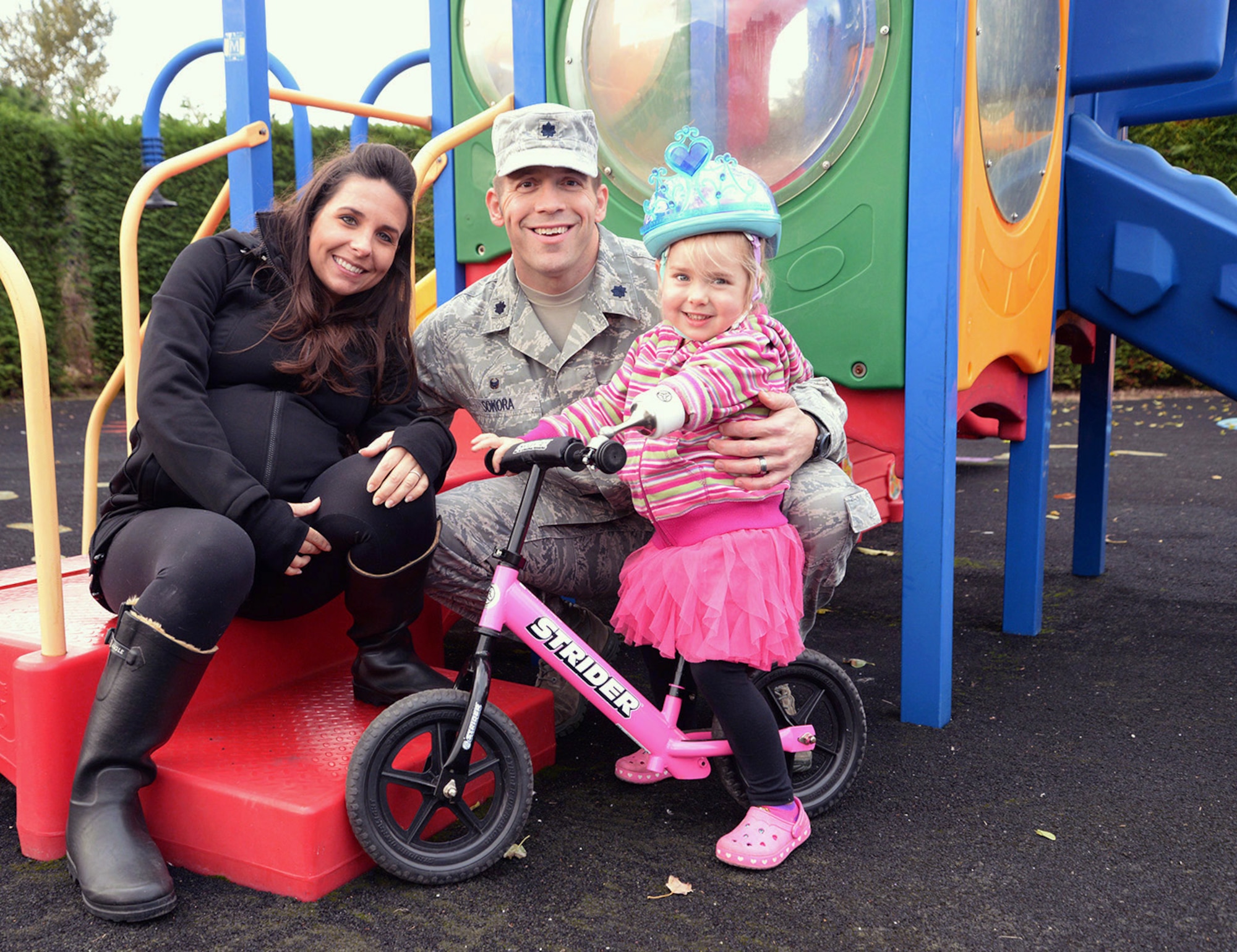 U.S. Air Force Lt. Col. Brandon Sokora, center, 100th Civil Engineer Squadron commander, poses for a photo with his wife Lindsay and youngest daughter Aliya, 3, Oct. 19, 2016, on RAF Mildenhall, England. Aliya was born a congenital amputee, without her left lower arm, and in 2011 Sokora was diagnosed with multiple sclerosis. October is National Disability Employment Awareness Month and the 100th CES commander shared his and his daughter’s story at a lunch celebrating the many varied contributions of America’s workers with disabilities. (U.S. Air Force photo by Karen Abeyasekere)