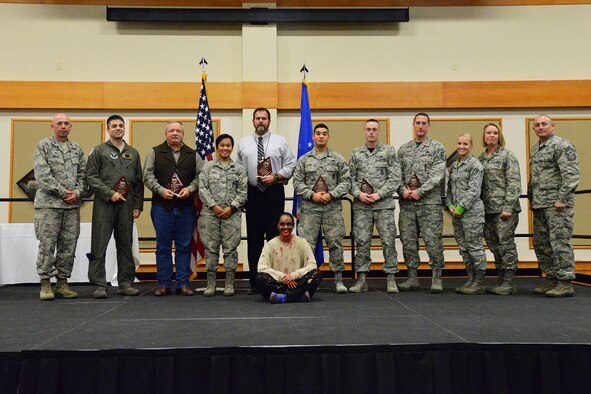 Winners of the third quarter Wing Quarterly Awards pose for a photo at the Grizzly Bend Oct. 21, 2016. Pictured from left to right are: Col. Ron Allen, 341st Missile Wing commander; Volunteer of the Quarter, 1st Lt. James Perkins, 490th Missile Squadron; Civilian Category I non-supervisory, John Dresel, 341st Medical Operations Squadron; Dormitory of the Quarter accepted by Airman 1st Class Jane Nucal, 341st Missile Maintenance Squadron; Civilian Category II supervisory, Stanley Moody, 341st Security Forces Group; Airman of the Quarter, Senior Airman Basil Huynh, 341st Missile Security Forces Squadron; NCO of the Quarter, Tech. Sgt. Zachary Linton, 341st MSFS; Senior NCO of the Quarter, Master Sgt. Timothy Jez, 341st MMXS; Professional Team of the Quarter, Physical Therapy accepted by Senior Airman Kaitlyn Callahan and Maj. Amy Quinlisk, 341st MDOS; Chief Master Sgt. Thomas Stiles, 341st MW command chief; Staff Sgt. Yeritza Lomick, 341st MW. Not pictured are: Dorm of the Quarter, Airman 1st Class Devinci Villafane, 341st Logistics Readiness Squadron; Spouse of the Quarter, Jessica Cooley, 819th RED HORSE Squadron; Honor Guard member of the Quarter, Airman Taylor Brown, 341st Maintenance Group; Civilian Category II non-supervisory, Kevin Younkin, 341st Operations Group; Civilian Category I supervisory, Leighton Dresch, 341st MXG; Company Grade Officer of the Quarter, Capt. Jacob Bright, 819th RHS. (U.S. Air Force photo/Airman 1st Class Daniel Brosam)