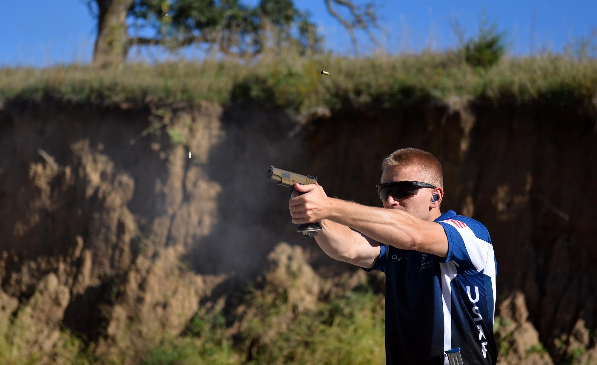 U.S. Air Force 2nd Lt. Casey Ryan, 55th Security Forces Squadron Officer-in-Charge of Logistics, fires his .40 caliber STI Eagle at silhouette targets placed inside of a berm at the Eastern Nebraska Gun Club on Sept. 28 in Louisville, Neb.  When representing the Air Force in shooting competitions, Ryan also uses a JP Enterprises CTR-02 rifle and a Beretta 1301C shotgun.  (U.S. Air Force photo by Josh Plueger)