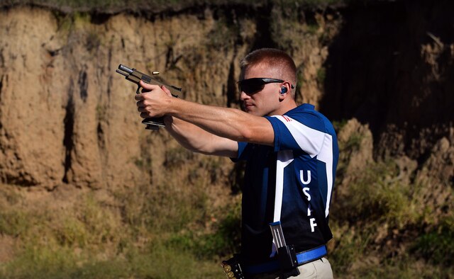 U.S. Air Force 2nd Lt. Casey Ryan, 55th Security Forces Squadron Officer-in-Charge of Logistics, fires his competition .40 caliber STI Eagle at targets set up in a berm at the Eastern Nebraska Gun Clun on Sept. 28 in Louisville, Neb.  The pistol is one of three guns Ryan uses when he represent the U.S. Air Force in shooting contests.  (U.S. Air Force photo by Josh Plueger)