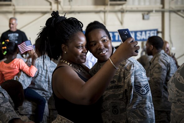 Staff Sgt. Brandi Johnson, 822d Base Defense Squadron security forces member, poses for a selfie with a loved one after returning from a deployment to Southwest Asia, Oct. 21, 2016, at Moody Air Force Base, Ga. The 822d BDS maintains readiness to deploy at a moment’s notice by upholding all combat and specialty training standards. (U.S. Air Force photo by Airman 1st Class Daniel Snider)