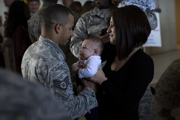 Staff Sgt. Nicholas Groomes, 822d Base Defense Squadron security forces member, greets his family after returning from a deployment to Southwest Asia, Oct. 21, 2016, at Moody Air Force Base, Ga. More than 100 Airmen returned home from supporting the 822th BDS's expeditionary force protection mission. (U.S. Air Force photo by Airman 1st Class Daniel Snider)