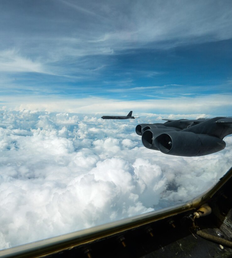 From the cockpit of a B-52 Stratofortress from Barksdale Air Force Base, La., a fellow B-52 can be seen flying over the Gulf of Mexico Oct. 13, 2016. The B-52s were participating in an integration exercise between Barksdale’s 340th Weapons School and the 77th Weapons School, Dyess Air Force Base, Texas. The integration was the capstone event of a six month training course, involving extensive communication planning across more than 10 agencies within the bomber community, followed by a live fly exercise. (U.S. Air Force photo/Senior Airman Curt Beach)