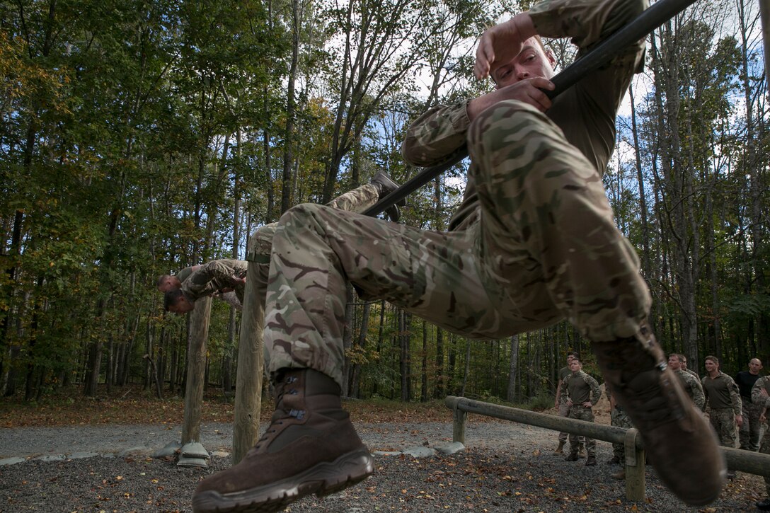 Royal Marine Thomas Bradbury, 43 Fleet Protection Group Royal Marines, attempts to get over the first obstacle at The Basic School’s obstacle course before taking on the endurance course during Exercise Tartan Eagle 16 Phase II, aboard Marine Corps Base Quantico, Va., Oct. 22. Tartan Eagle Phase II is the continuation of a bilateral exercise involving Marines and sailors from Marine Corps Security Forces and their British counterparts, the 43 FPGRM.  The Marines and sailors from Marine Corps Security Forces took this opportunity to show the Royal Marines the rigors of the TBS obstacle and endurance course.