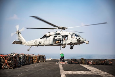 161021-N-BH414-247

ARABIAN GULF (Oct. 21, 2016) An MH-60S Sea Hawk helicopter assigned to the Dusty Dogs of Helicopter Sea Combat Squadron (HSC) 7 picks up cargo nets on the flight deck of the aircraft carrier USS Dwight D. Eisenhower (CVN 69) (Ike) during a replenishment-at-sea with the fleet replenishment oiler USNS Pecos (T-AO 197). Ike and its Carrier Strike Group are deployed in support of Operation Inherent Resolve, maritime security operations and theater security cooperation efforts in the U.S. 5th Fleet area of operations. (U.S. Navy photo by Seaman Casey S. Trietsch)