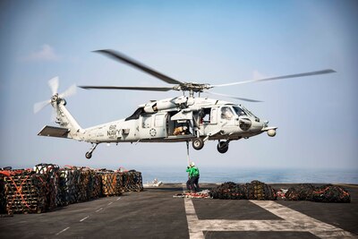 161021-N-BH414-247

ARABIAN GULF (Oct. 21, 2016) An MH-60S Sea Hawk helicopter assigned to the Dusty Dogs of Helicopter Sea Combat Squadron (HSC) 7 picks up cargo nets on the flight deck of the aircraft carrier USS Dwight D. Eisenhower (CVN 69) (Ike) during a replenishment-at-sea with the fleet replenishment oiler USNS Pecos (T-AO 197). Ike and its Carrier Strike Group are deployed in support of Operation Inherent Resolve, maritime security operations and theater security cooperation efforts in the U.S. 5th Fleet area of operations. (U.S. Navy photo by Seaman Casey S. Trietsch)